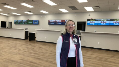 Angi Daus, Asheville Regional airport's vice president for air service and corporate communications, stands in the airport's new rental car building Monday, May 18, 2026.