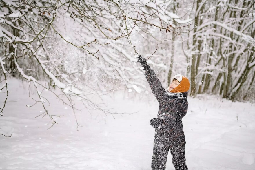 child playing in snow