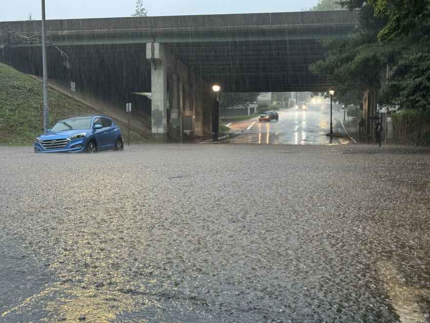 Localized flooding on a road in Asheville on Sept. 25, 2024, as rains ahead of Hurricane Helene rolled into the region. Most of Western North Carolina is under a flood watch through Friday night.