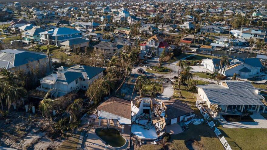 Aerial view of hurricane damage in a neighborhood