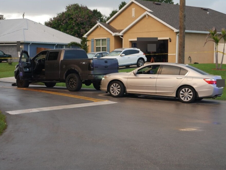 The two vehicles involved in the road rage incident, including a gray pickup and a silver sedan