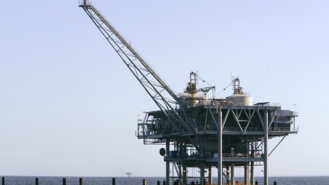 FILE - This April 13, 2007, file photo, shows a natural gas platform off the coast of Fort Morgan, Ala. The federal agencies that make and enforce offshore oil and gas leases will encourage new wells in shallow Gulf of Mexico waters by allowing some reduced-royalty or even royalty-free production if owners can prove they need it. Officials say $20 billion worth of oil and gas may go untapped without changes described in a report issued Tuesday, Nov. 19, 2019. (AP Photo/Rob Carr, File)