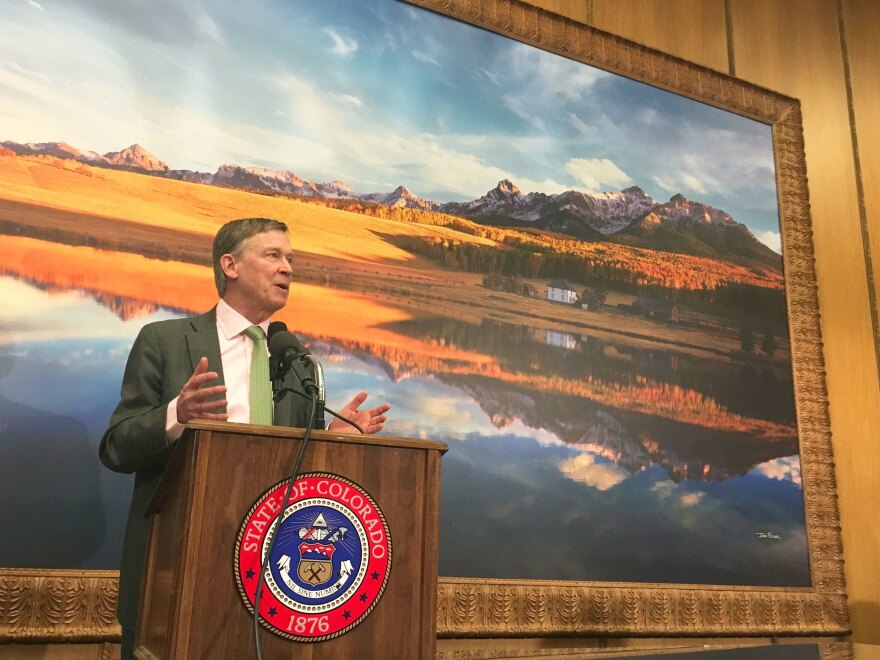 Colorado Gov. John Hickenlooper, seen here at a March 29 press conference on air pollution, is proposing more regulations on the oil and gas industry.