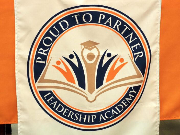 A banner bearing the Proud To Partner Leadership Academy logo hangs from a table at a board meeting at the charter school in southwest Oklahoma City on Nov. 18.