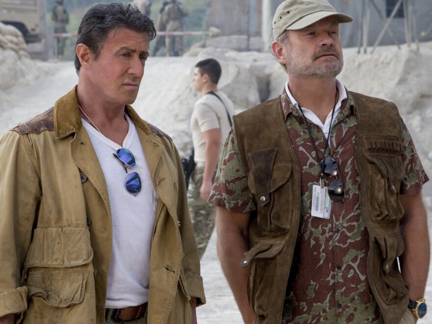 Kelsey Grammer (right) plays Bonaparte, a retired mercenary who assists Sylvester Stallone's Barney with recruiting new members of the Expendables team.