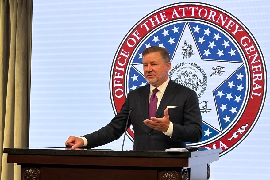 Attorney General Gentner Drummond speaks at the state capitol.