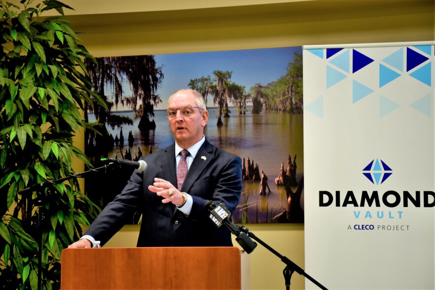 Gov. John Bel Edwards applauds Cleco Power's $900 million plan to capture carbon at its largest, coal-fired power unit at the Brame Energy Center on Tuesday, April 11, 2022.