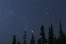 The constellation Orion is framed by two Perseid meteors on Aug. 12, 2018, in Cedar Breaks National Monument, Utah.