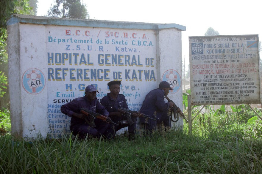 Police guard a hospital in Butembo, Congo, on Saturday after militia members attacked an Ebola response command center in the city's Katwa district overnight.