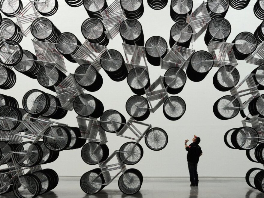 A man admires <em>Forever Bicycles</em>, a work by Ai Weiwei, at the Taipei Fine Art Museum last month. 