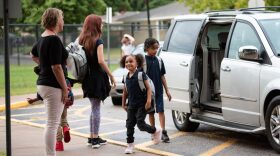 In this September 2019 photo, first grader Nola Southern smiles at Jones Elementary School teacher Carol Moshiri after being dropped off at the Tulsa school. 
