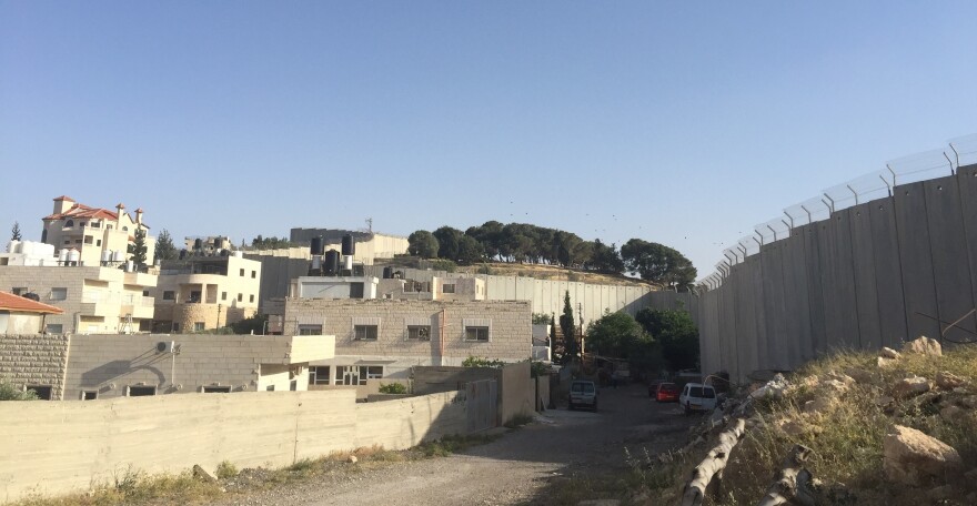 A view of the Palestinian town Abu Dis and the barrier that separates it from Jerusalem.