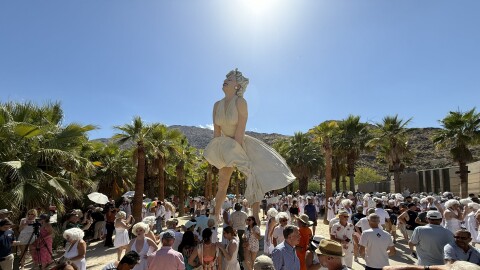 Marilyn Monroe lookalikes gather near the Marilyn Forever statue in downtown Palm Springs.