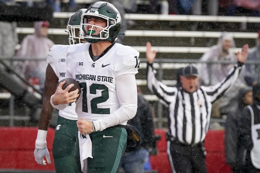 Michigan State quarterback Katin Houser (12) celebrates after scoring a touchdown during the first half of an NCAA college football game against Rutgers Saturday, Oct. 14, 2023, in Piscataway, NJ. 