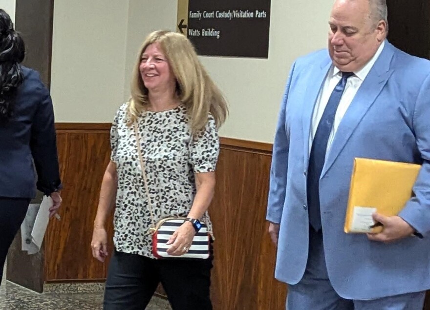 Michelle Marini leaves a Monroe County courtroom with attorney Joe Damelio on Tuesday, July 2, 2024.