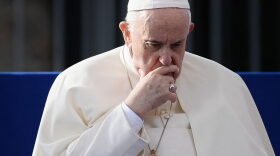 Pope Francis ponders during a Prayer and Meeting for Peace, promoted by the Community of SantEgidio by the Colosseum monument in Rome.