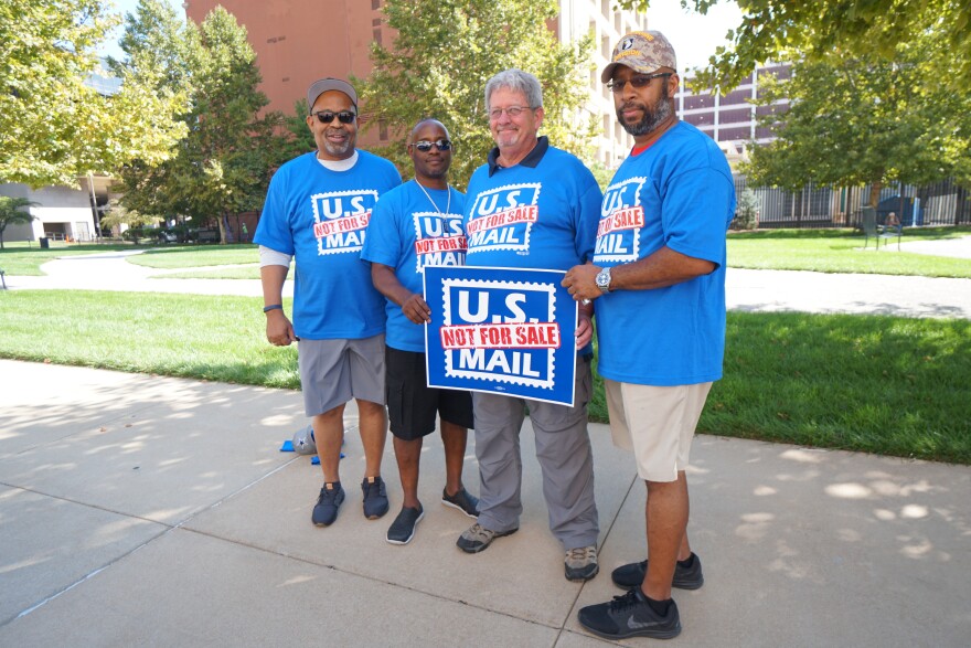 Members of National Association of Letter Carriers rallied against privatization of the U.S. Postal Service in cities around the country including St. Louis on Monday. Pictured above (l to r): Marvin Booker, Frank Enlow, Bill Lister, and Richard Thurman.