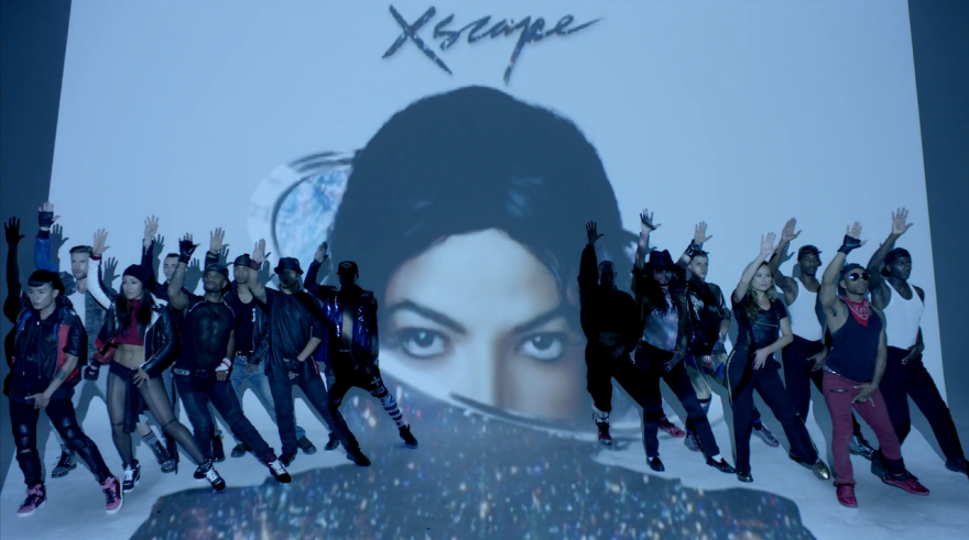 Dancers pose reverently in the video for "Love Never Felt So Good," the lead single from Michael Jackson's posthumous <em>Xscape</em> album.