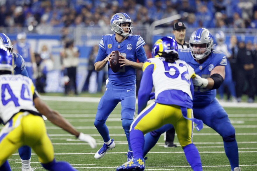 Detroit Lions quarterback Jared Goff throws during the first half of an NFL wild-card playoff football game against the Los Angeles Rams, Sunday, Jan. 14, 2024, in Detroit. (AP Photo/Duane Burleson)