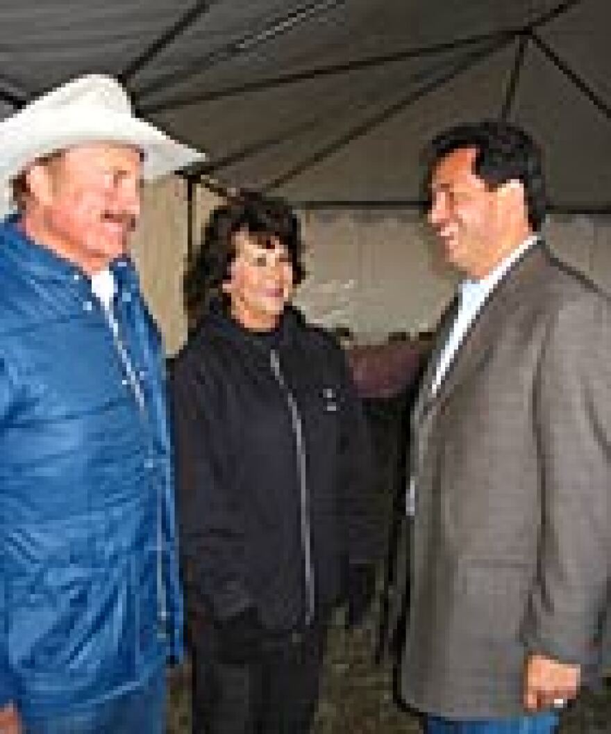 John Sanchez, right, meets with supporters at a barbecue at the CR Land and Cattle Ranch in Estancia, N.M.