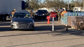 National Guard members give out water, ice and food to people in need after Hurricane Ian. This site at the the North Fort Myers Recreation Center is open from 8 a.m. to 5 p.m. daily, until further notice.