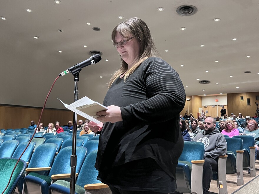 Parent Jennifer Johnson speaks about her fifth grader and their grade's challenges, voicing concerns about sixth graders moving to Hibbing High School during a March 26, 2026, public hearing at Lincoln Middle School in Hibbing.