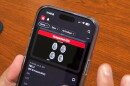 a hand holding a smart phone with brain images from Rapid AI on the screen.
