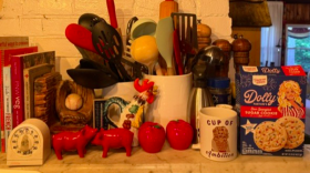 The writer's kitchen counter, featuring “a cup of ambition” and Parton-brand sugar cookie mix.