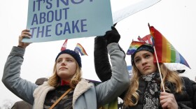 Lydia Macy, 17, left, and Mira Gottlieb, 16, both of Berkeley, Calif., rally outside of the Supreme Court which is hearing the 'Masterpiece Cakeshop v. Colorado Civil Rights Commission' today, Tuesday, Dec. 5, 2017, in Washington. (AP Photo/Jacquelyn Martin)