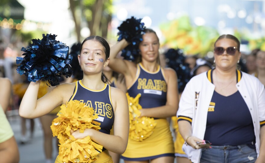 Montoursville Area cheerleaders walk in the Little League World Series parade.