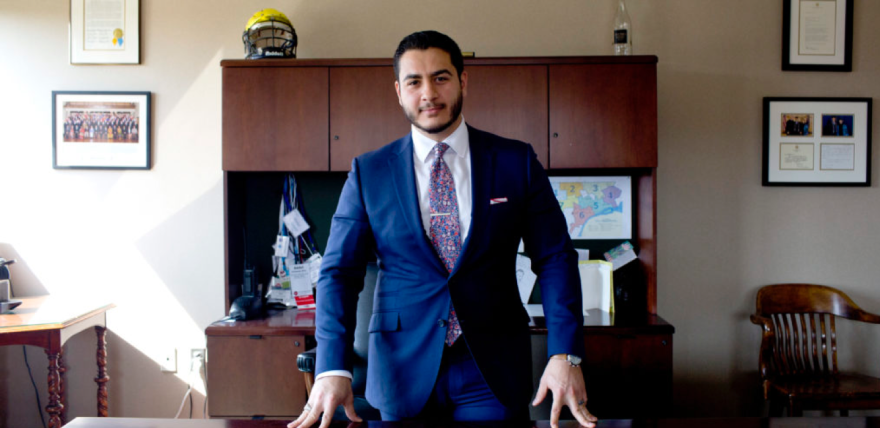 dr abdul el sayed behind a desk