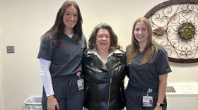 From left to right, PA student Laureli Simpson, Bruna Varalli-Claypool, a PA program faculty member, and PA student Megan Giddens.
