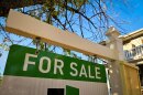A For Sale sign pitched out in front of a Salt Lake City home, July 23, 2026.