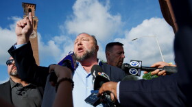 Alex Jones arrives to Waterbury Superior Court on Tuesday, September 20, 2022. He is expected to testify in a trial to determine how much he must pay in damages to the families of victims killed in the Sandy Hook Elementary School shooting.