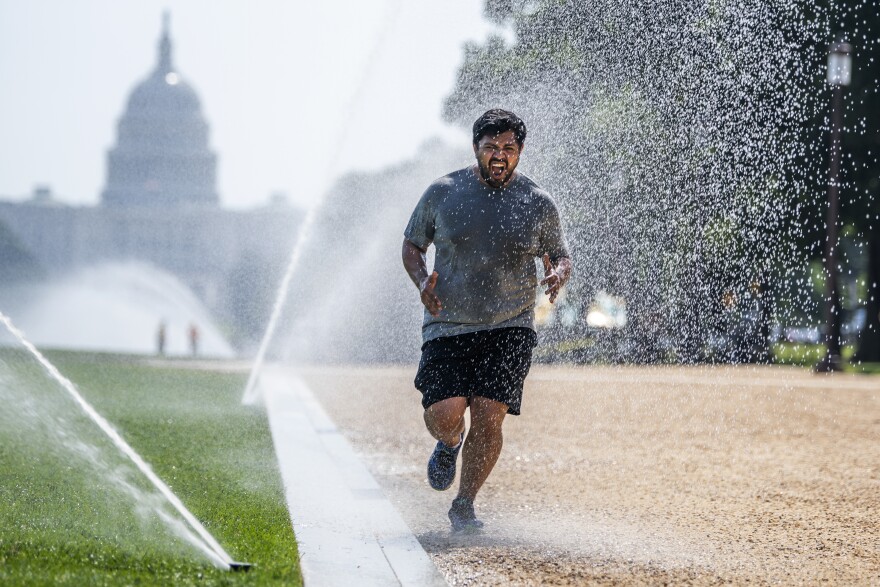 If you must exercise when the the sun is high, dousing yourself with water, as this jogger did last month in steamy Washington, D.C., could help cool you down. Heat stroke is no joke, experts warn. Learn the signs to stay safe.