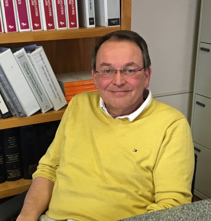 Barre City Mayor Thom Lauzon sits in an office.