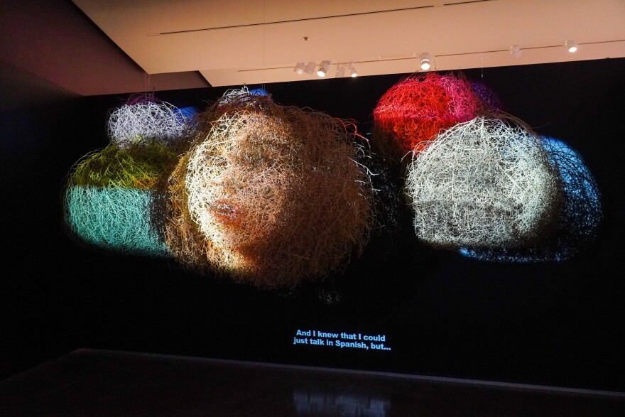 A video projecting on an art installation that simulates tumbleweeds.