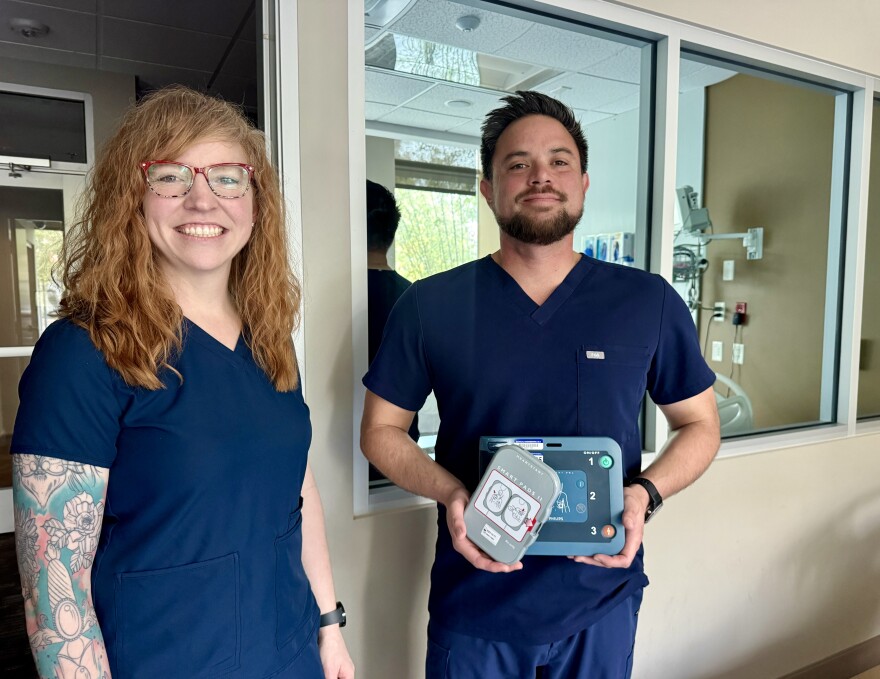 Dignity Health's Jessica Bower and French Hospital Medical Center's Greg Larsen with one of the AED devices which are being strategically placed around the City of San Luis Obispo to get quicker aid to cardiac arrest victims.