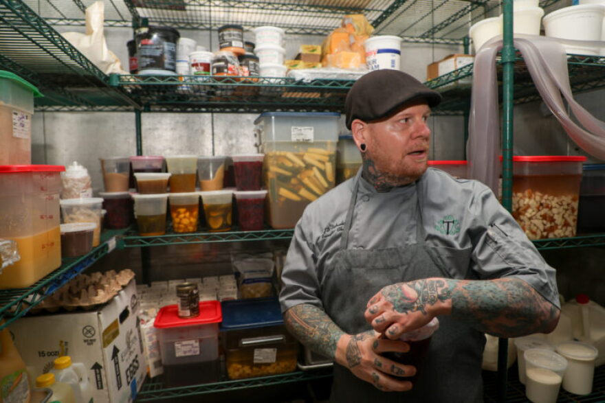 Chef JD Eubanks in the walk-in fridge at a French Quarter restaurant on Wednesday, April 2, 2025.