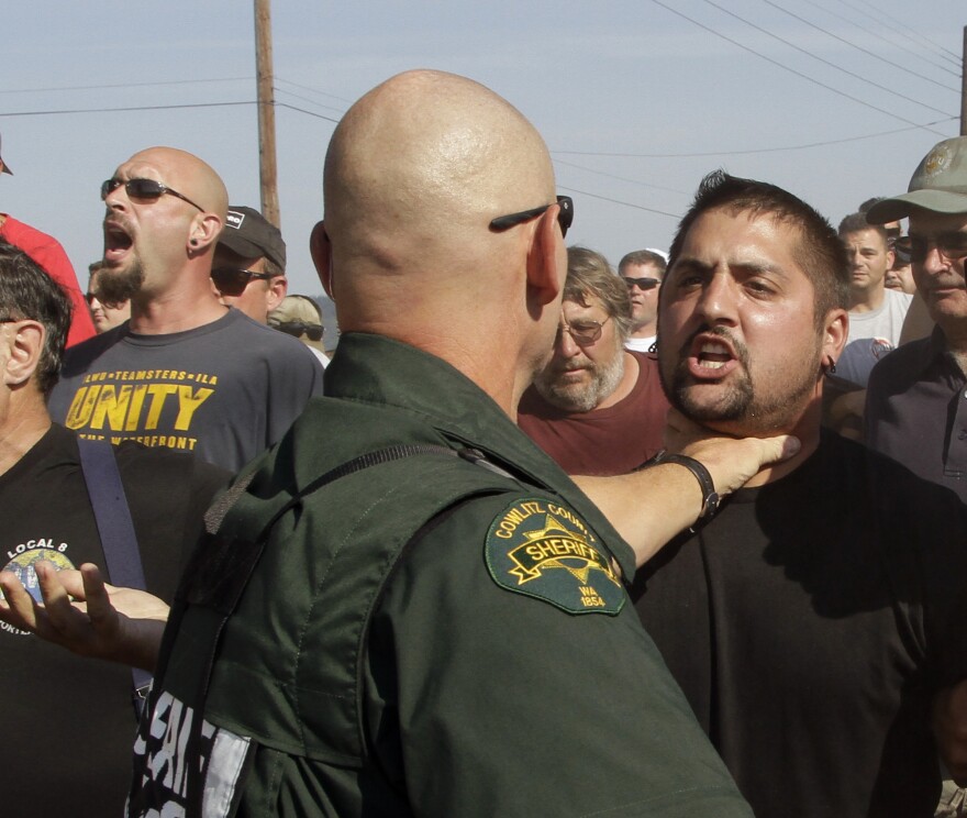 Longshoremen tactics in Longview have resulted in confrontations with police and now a major fine from a judge.