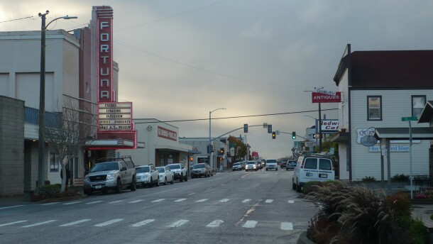 Street in Fortuna, California, with cars parked along the side of the road.