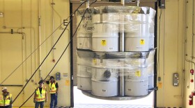 FILE - In this April 9, 2019, file photo, provided by Los Alamos National Laboratory, barrels of radioactive waste are loaded for transport to the Waste Isolation Pilot Plant, marking the first transuranic waste loading operations in five years at the Radioactive Assay Nondestructive Testing (RANT) facility in Los Alamos, N.M. On Thursday, Dec. 8, 2022, New Mexico officials outlined new conditions for a proposed permit for the U.S. government to continue disposing of nuclear waste in the southeast corner of the state as part of a multibillion-dollar federal cleanup program. (Nestor Trujillo/Los Alamos National Laboratory via AP, File)