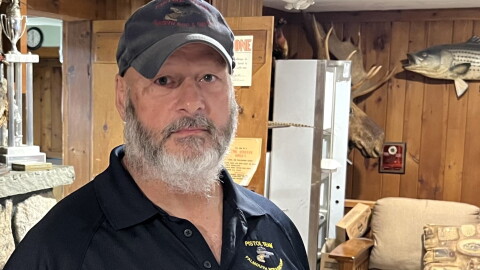 Carl Simons, a member of the Falmouth Rod & Gun Club, supports the "no" campaign on Question 9 on the Nov. 3 ballot.