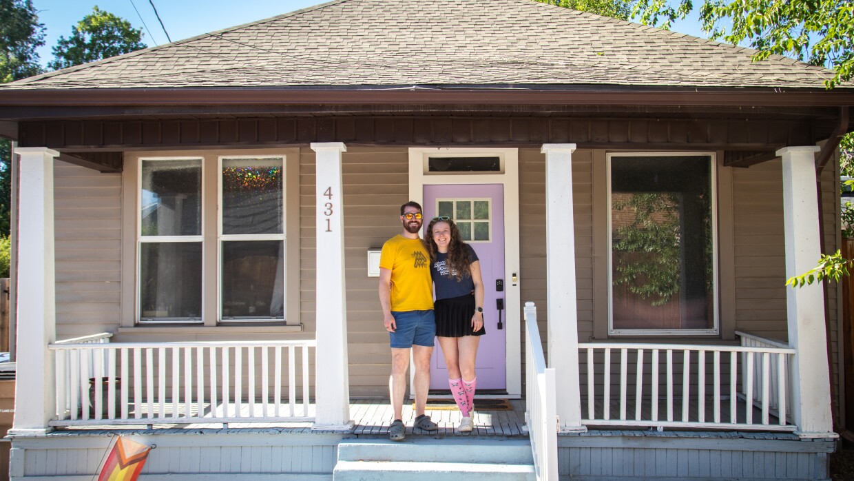 Joel Roop-Eckart and Belle Barnes pose in front of their Central City neighborhood fixer-upper.