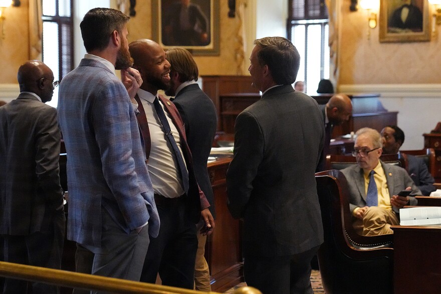Sen. Ed Sutton, D-Charleston, speaks with Sen. Deon Tedder, D-Charleston, and Sen. Rusell Ott, D-Calhoun, during the hemp derived consumable debate in the Senate chamber at the Statehouse on March 19, 2026. during the hemp derived consumable debate in the Senate chamber at the Statehouse on March 19, 2026.