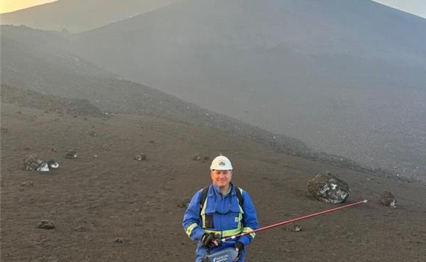 Dr. Andres Diaz holds the HAPSITE® Scout (a multi-gas sensing and sampling unit) on Mount Etna’s South Crater