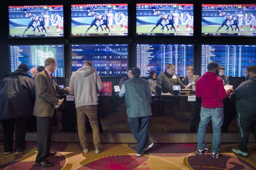 Gamblers place bets in the temporary sports-betting area at the SugarHouse Casino in Philadelphia on Dec. 13, 2018.