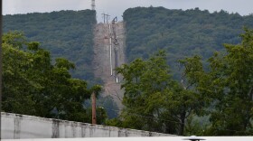 Crews work over a mountain ridge to install the Transco Pipeline.