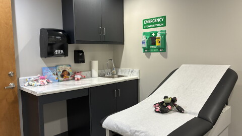Exam room with stuffed animals and children's books