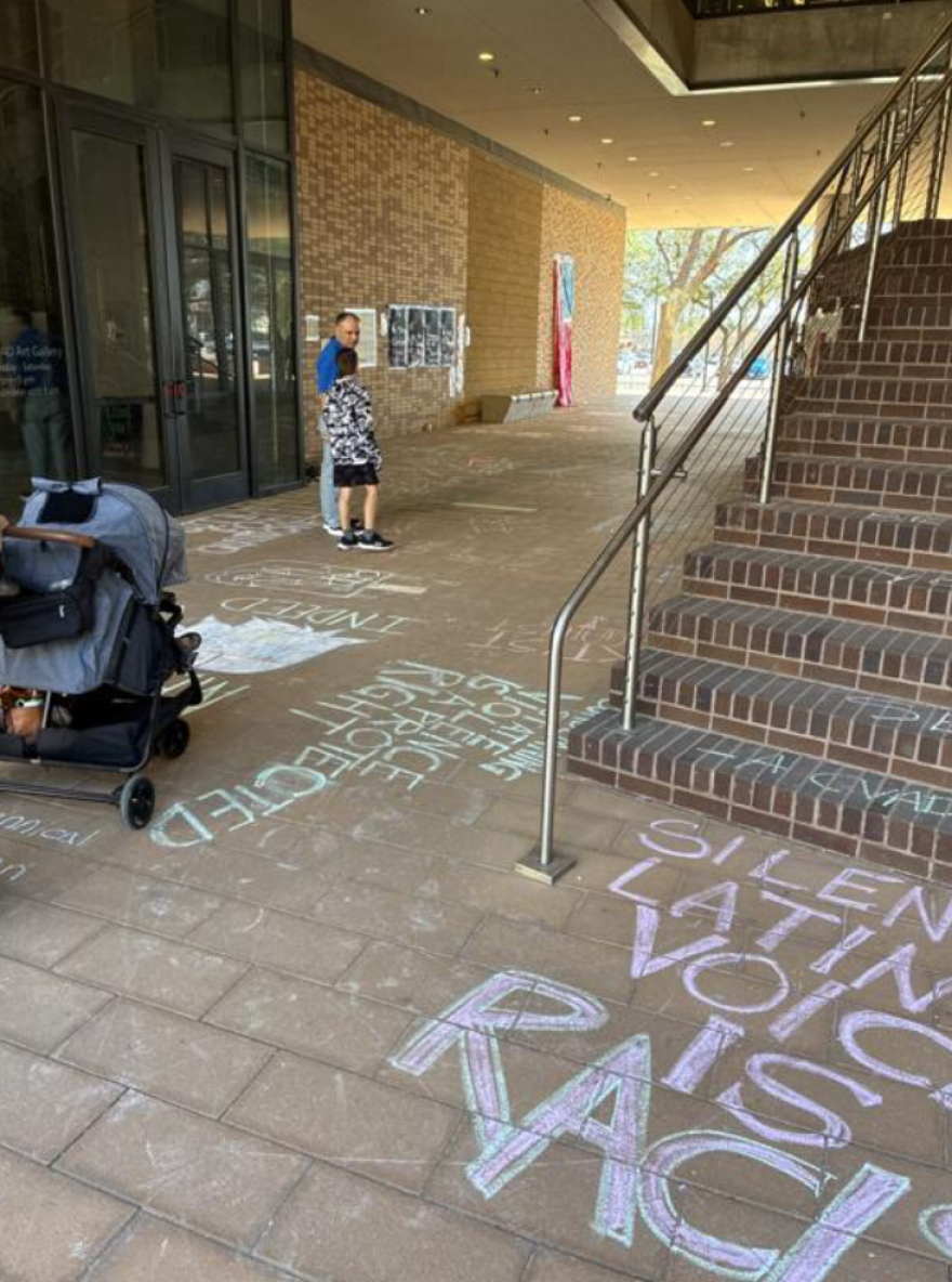 In a photo shared with the Denton Record-Chronicle in March, protest art and messages written in chalk can be seen in the breezeway at the College of Visual Arts & Design in Denton. The protest art and chalk messages were removed.